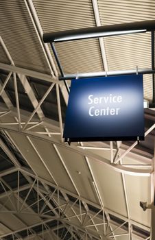 Blue Signage Marks the Customer Service Center in a Public Building Shoipping Structure