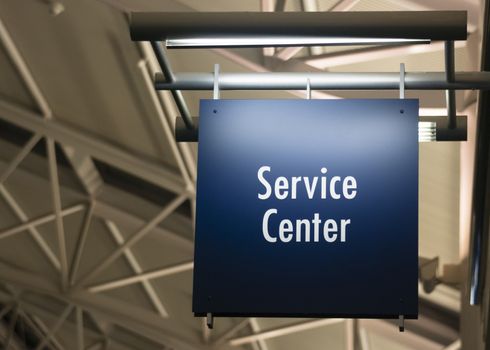 Blue Signage Marks the Customer Service Center in a Public Building Shoipping Structure