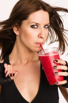 Attractive Athletic Female ShowsHappy Holding Refreshing Blended Food Fruit Smothie Drink