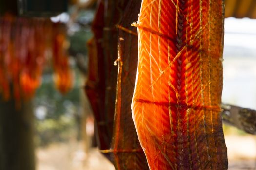 Meat is cut and hanged to dry outdoors in the lodge