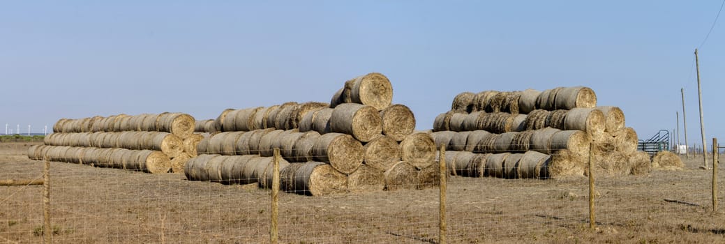 View of a stack of hay bales on the countryside.