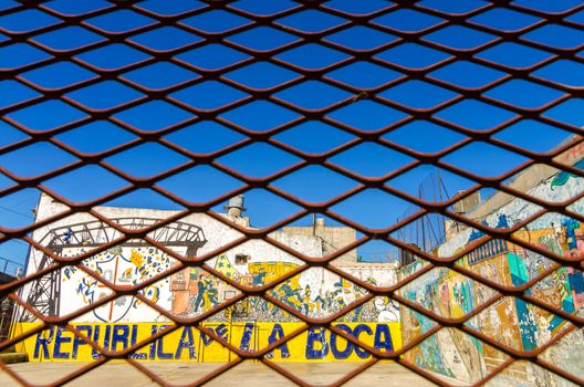 BUENOS AIRES - AUGUST 15: Grafitti in La Boca neighborhood of Buenos Aires on August 15, 2013.  La Boca is one of the main tourist destinations in the city and is also the birthplace of tango  
