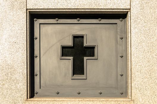 Cross decorating a tomb in the Recoleta cemetery in Buenos Aires, Argentina