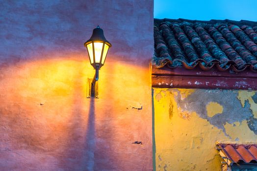 Old colonial buildings and a streetlight at night in the old town of Cartagena, Colombia