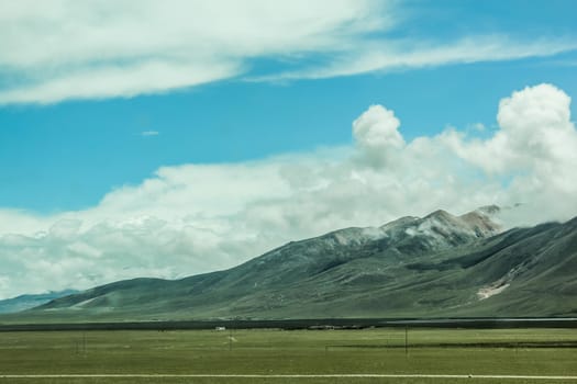 Scenic landscape view of snow mountain ranges and surroundings in Tibet 