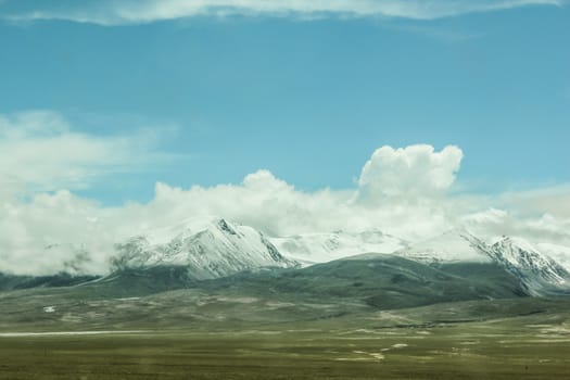 Scenic landscape view of snow mountain ranges and surroundings in Tibet 