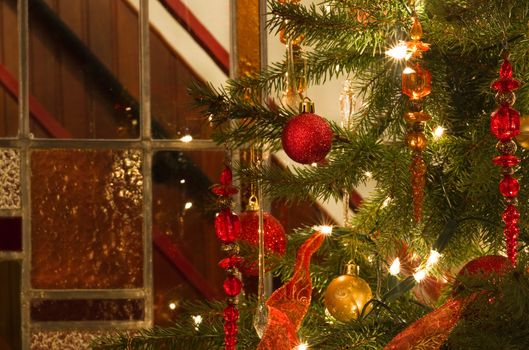 Decorated christmas tree and stained glass window - horizontal