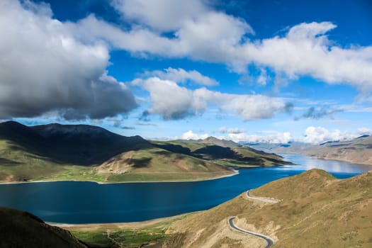 Beautiful landscape with high altitude lake cloud and mountains during a sunny day