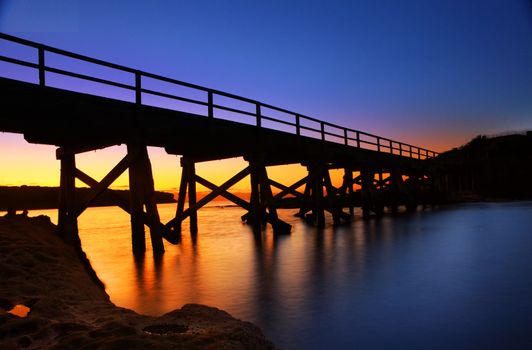 Silhouetted pier bridge to Bare Island Botany Bay Auistralia