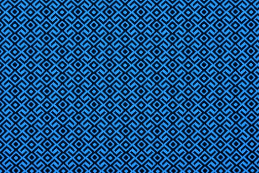 Material in geometric patterns, a textile background.