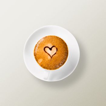 cup of coffee with a heart drawn on the foam