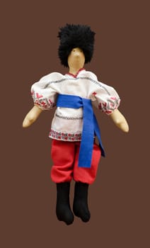 The Handmade isolated doll boy in Ukrainian folk costume