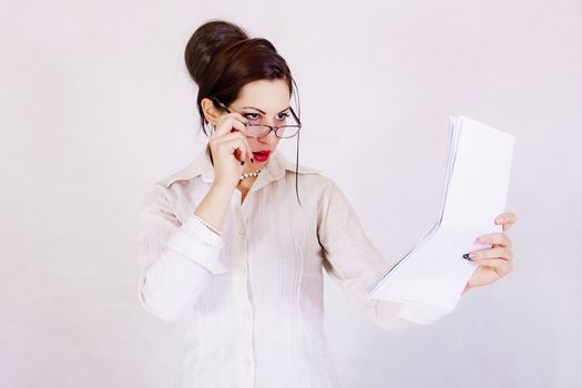 portrait of attractive business woman holding papers