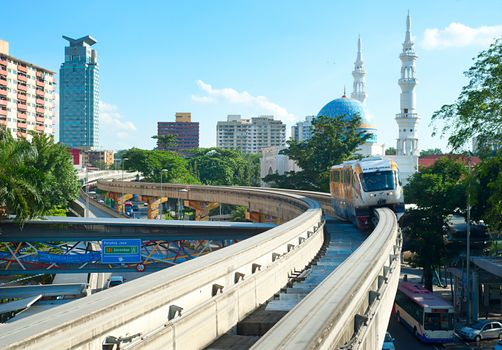 Kuala Lumpur, Malaysia - May 13, 2013: Monorail train arrives at a train station in Kuala Lumpur, Malaysia. Kuala Lumpur metro consists of 6 metro lines operated by 4 operators.