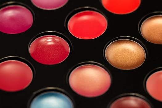 Close-up shot of lip gloss palette, soft focus