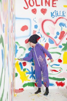 Little Girl painting a room