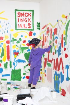 Little Girl painting a room