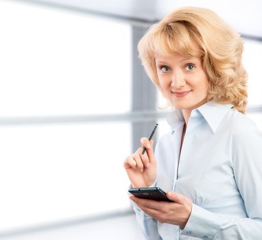 Business woman using her smartphone