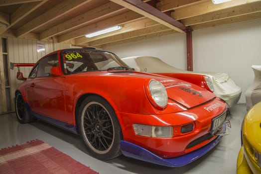 All the photos are shot in a garage in Halden, Norway where race cars and racing motorcycles are maintained and overhauled