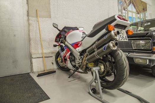 All the photos are shot in a garage in Halden, Norway where race cars and racing motorcycles are maintained and overhauled