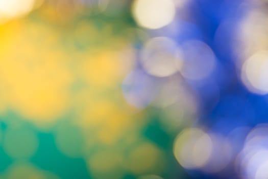 Christmas blurred background of green, blue and gold