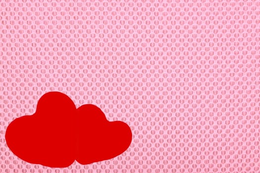Two hearts on a pink background, Valentine's Day.
