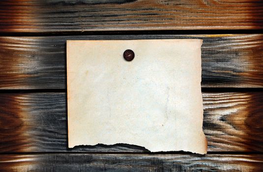 Blank Paper hanging on the Wooden Background