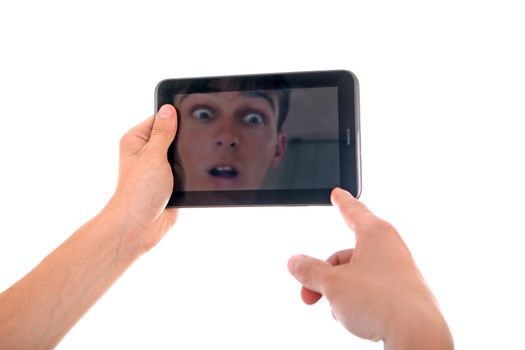 Reflection of Surprised Face in Display of Tablet Computer Isolated on the White Background