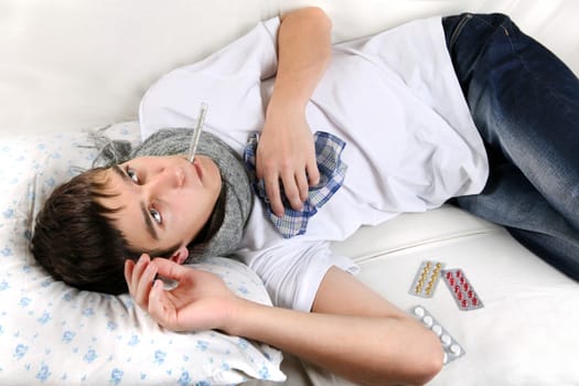 Diseased Young Man lying on the Bed