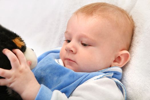 Baby Boy Playing with a Toy Closeup