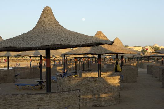 Deck chairs on a stand with umbrella 