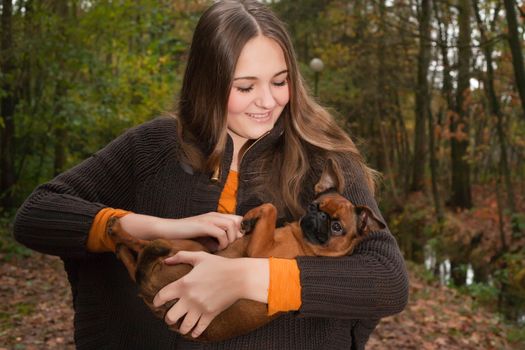 Young teenage girl is having a nice time in the cold november