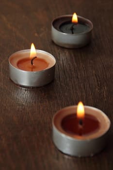 Three candles in brown tones. Cinnamon and apple