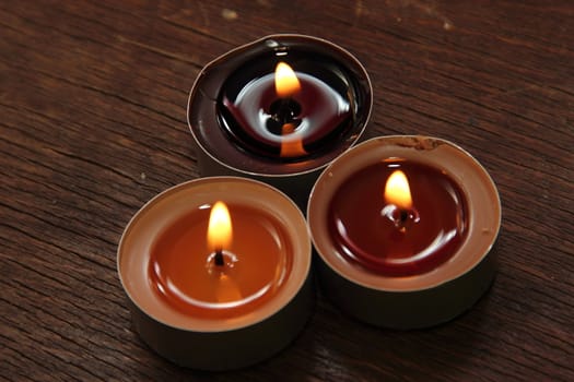 Three candles in brown tones. Cinnamon and apple