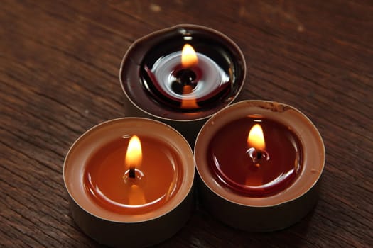 Three candles in brown tones. Cinnamon and apple