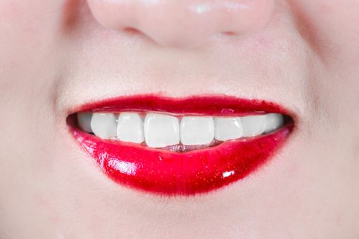 Closeup of woman's lips with makeup smiling