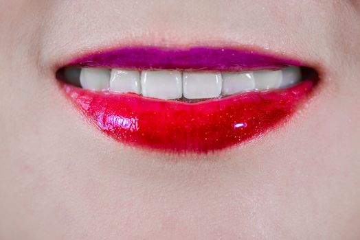 Closeup of woman's lips with makeup smiling