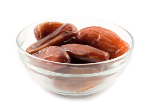 Figs in a glass plate on a white background