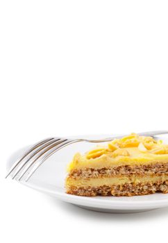 Closeup view of piece of sweet pie and fork on a white plate