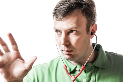 Male doctor in green shirt with red stethoscope explaining something