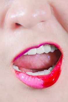 Closeup of woman's lips with makeup yelling out loud