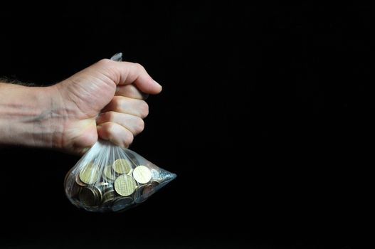 Trapped Money And an Hand on a Black Background