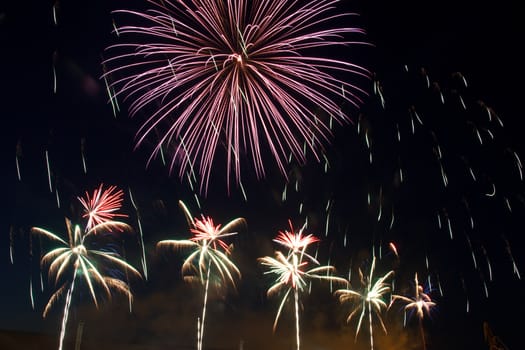 colorful balls of fireworks in a night sky