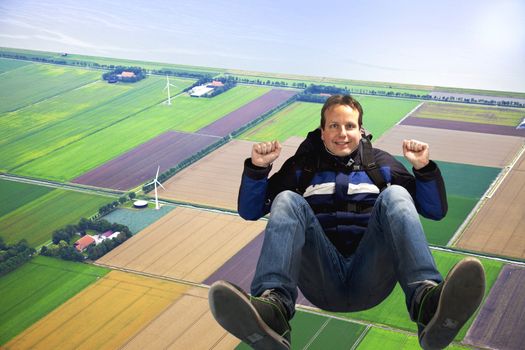 Man jumping out of plane with parachute