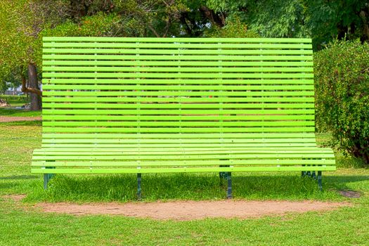 gigantic green bench in the park