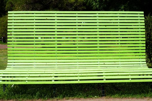 gigantic green bench in the park