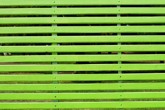 gigantic green bench in the park