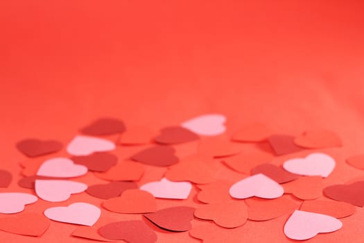 Valentines day red background with many paper hearts