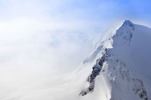 Beautiful panorama of mountain peaks in winter
