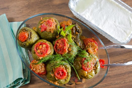 Turkish Stuffed green bell pepper dolma's ready to serve along with homemade yogurt